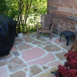 Left side of the patio and grill.